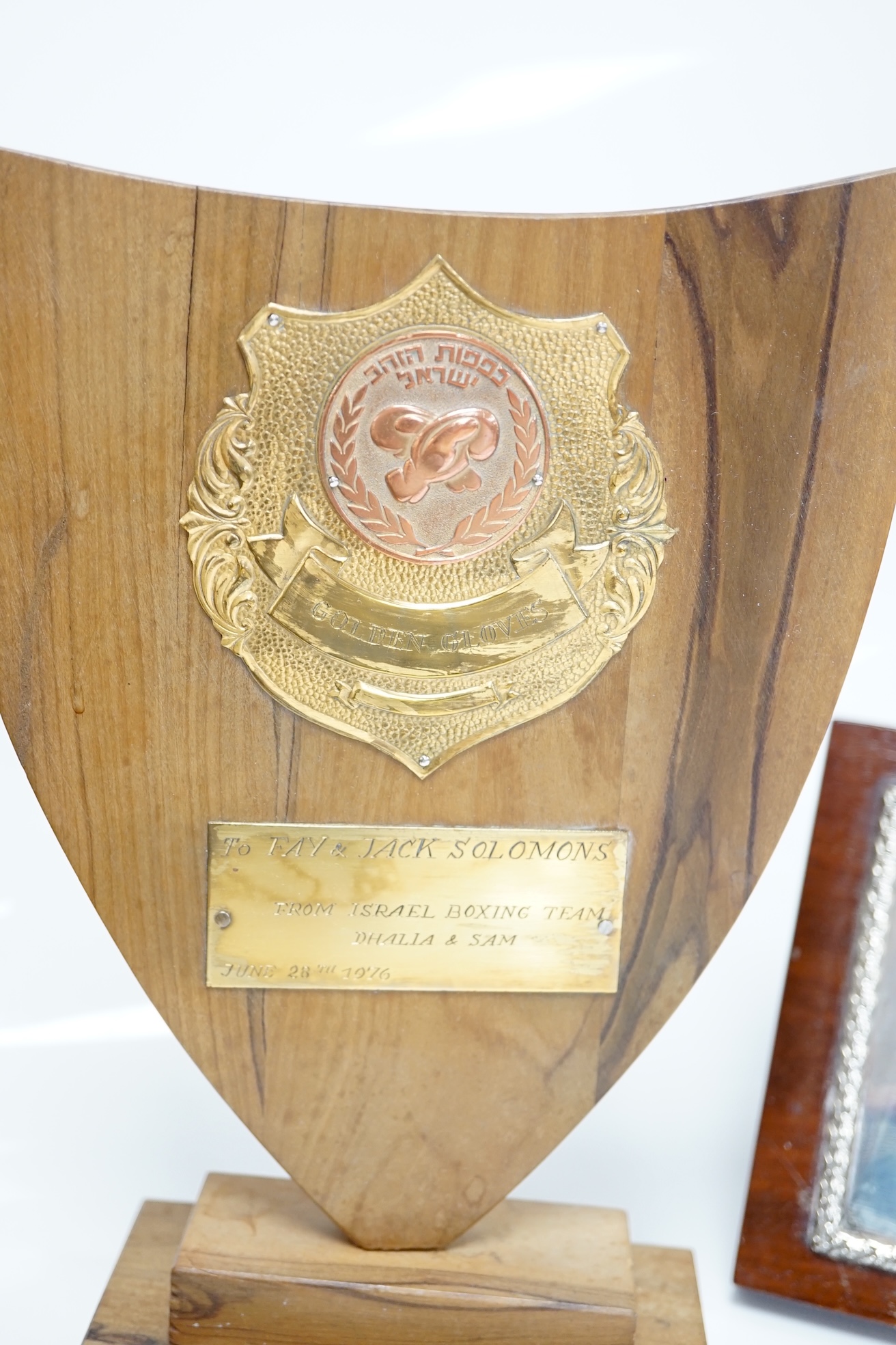 A 1940's engraved silver mounted wooden plaque, presented by Boxing News to Jack Solomons , London, 1946, plaque width 16.3cm, together with a brass mounted Israel Boxing Team plaque, to Jack & Fay Solomons. Condition -